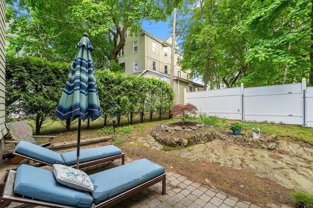 34 Sheafe St Unit 1, Brookline, MA 02467 - view of yard featuring fence, a patio area, and a gate