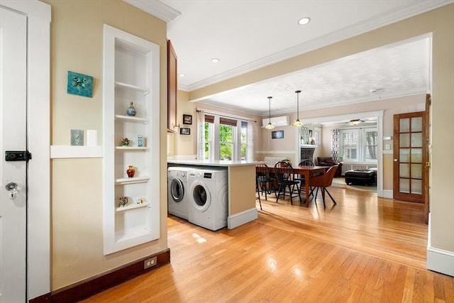 34 Sheafe St Unit 1, Brookline, MA 02467 - kitchen featuring light wood-type flooring, separate washer and dryer, crown molding, ceiling fan, and built in features
