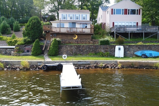 back of property with a water view