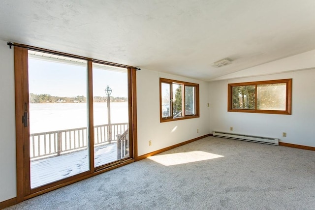 empty room with carpet flooring, a baseboard radiator, a water view, and vaulted ceiling