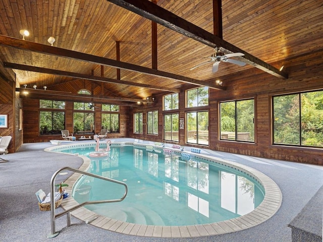 indoor pool with a patio area and ceiling fan