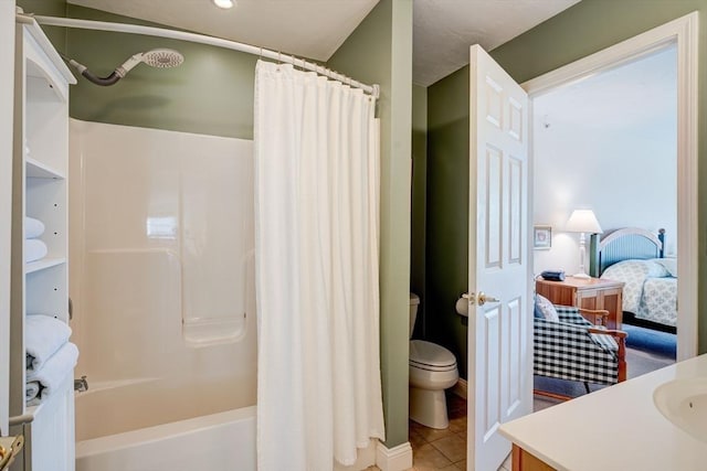 full bath featuring tile patterned floors, shower / bathtub combination with curtain, toilet, vanity, and ensuite bath