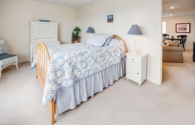 bedroom with light colored carpet, baseboards, and recessed lighting