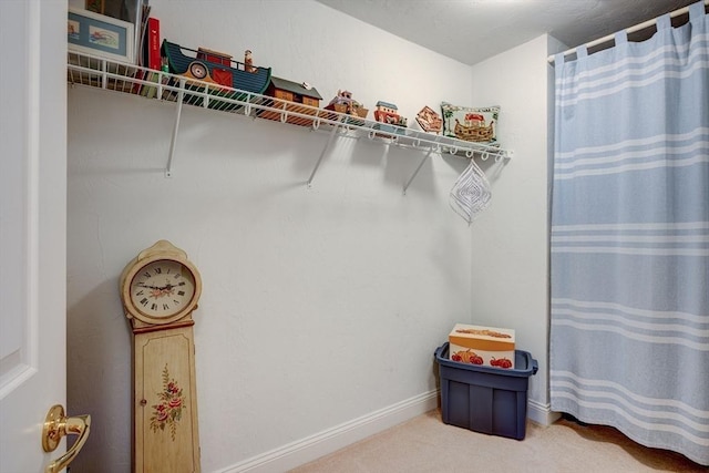 spacious closet with carpet flooring
