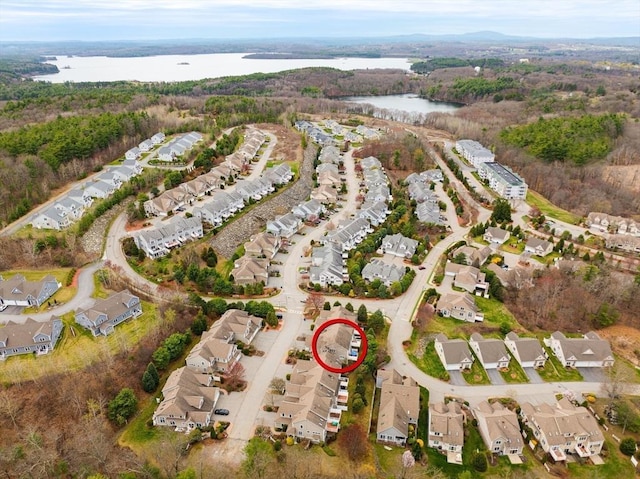 bird's eye view featuring a water view and a residential view