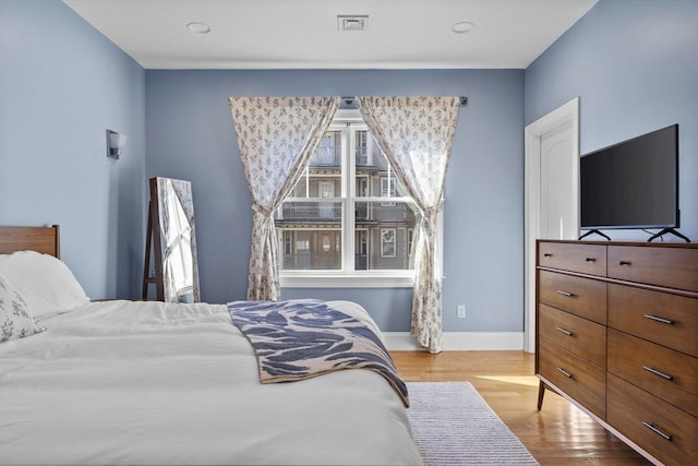 bedroom with light hardwood / wood-style floors