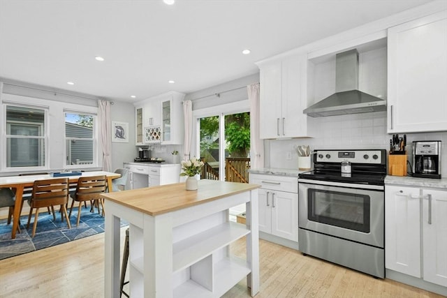 21 Milton Rd, Quincy, MA 02171 - kitchen with stainless steel electric range oven, wall chimney exhaust hood, open shelves, light wood-type flooring, and recessed lighting