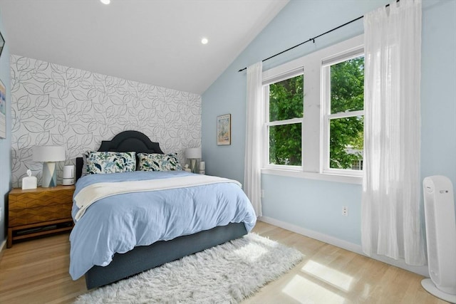 21 Milton Rd, Quincy, MA 02171 - bedroom with an accent wall, wallpapered walls, baseboards, wood finished floors, and lofted ceiling