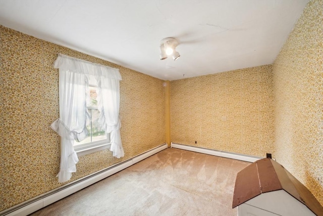 197-199 Main St, Chelmsford, MA 01863 - empty room with a baseboard radiator and carpet flooring