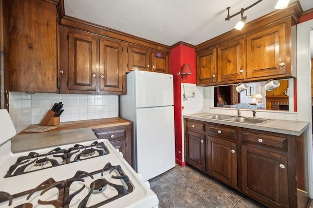 197-199 Main St, Chelmsford, MA 01863 - kitchen featuring a sink, white appliances, light countertops, and backsplash