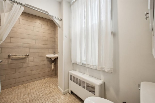 197-199 Main St, Chelmsford, MA 01863 - full bath with radiator, toilet, and a tile shower