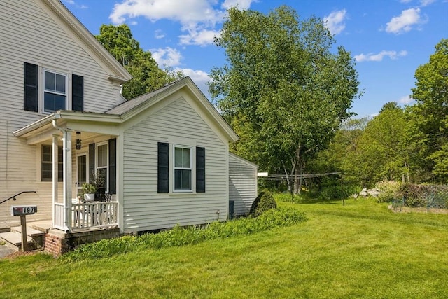 197-199 Main St, Chelmsford, MA 01863 - view of property exterior with a lawn and covered porch