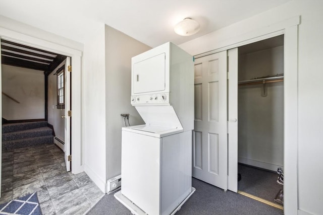 197-199 Main St, Chelmsford, MA 01863 - washroom featuring estacked washer and dryer, a baseboard radiator, and baseboards