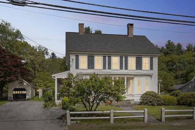 197-199 Main St, Chelmsford, MA 01863 - colonial house with a garage, a chimney, and asphalt driveway