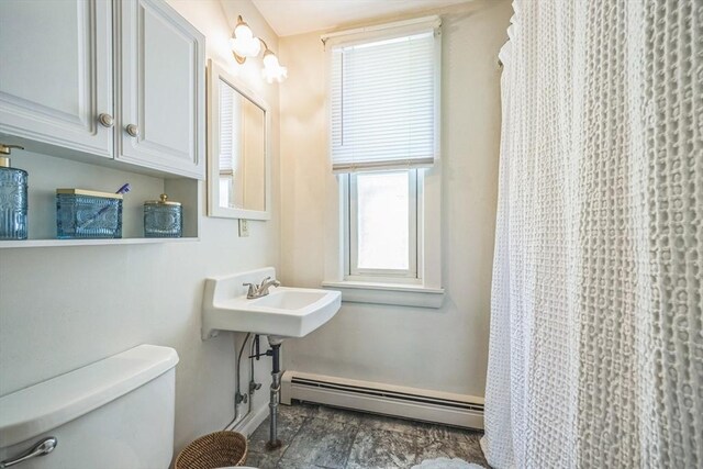 197-199 Main St, Chelmsford, MA 01863 - bathroom with a baseboard radiator, toilet, healthy amount of natural light, and baseboards