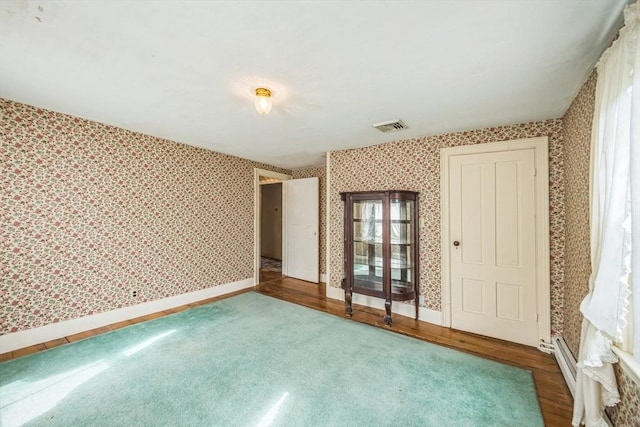 197-199 Main St, Chelmsford, MA 01863 - unfurnished bedroom featuring wallpapered walls, baseboards, and carpet