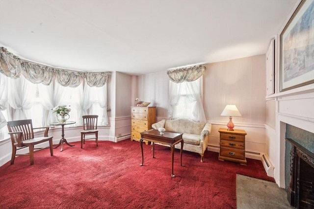 197-199 Main St, Chelmsford, MA 01863 - sitting room featuring healthy amount of natural light, a baseboard radiator, a fireplace with flush hearth, and carpet floors