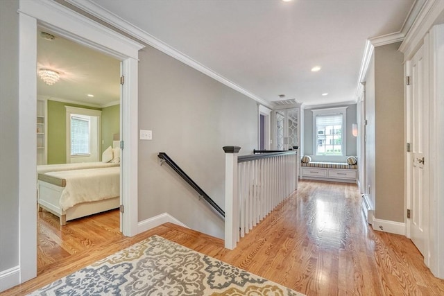 24 Cory Ln, Reading, MA 01867 - corridor with an upstairs landing, ornamental molding, light wood-style floors, baseboards, and recessed lighting