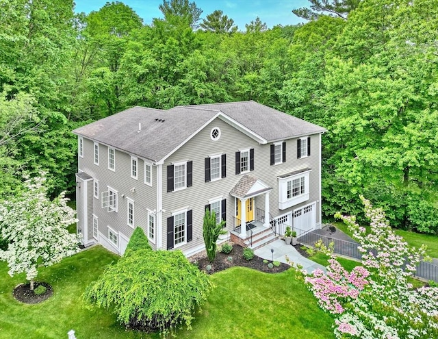 24 Cory Ln, Reading, MA 01867 - colonial house with a garage, a front yard, asphalt driveway, and roof with shingles