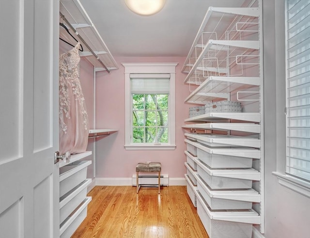 24 Cory Ln, Reading, MA 01867 - spacious closet featuring wood finished floors and baseboard heating