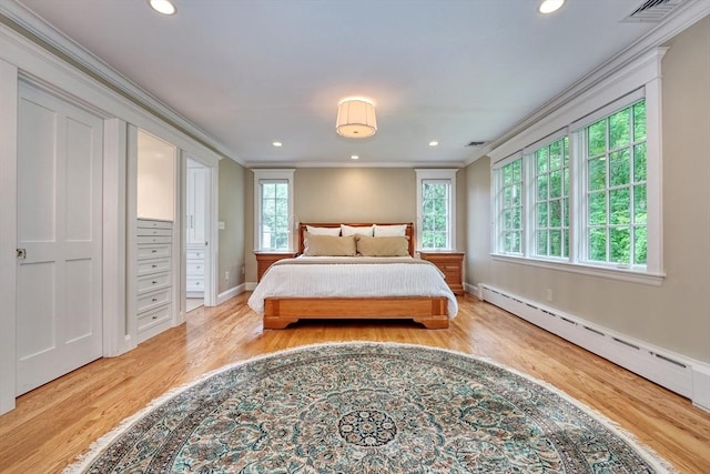 24 Cory Ln, Reading, MA 01867 - bedroom with ornamental molding, wood finished floors, a baseboard radiator, recessed lighting, and baseboards