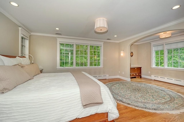 24 Cory Ln, Reading, MA 01867 - bedroom with ornamental molding, wood finished floors, a baseboard heating unit, arched walkways, and recessed lighting