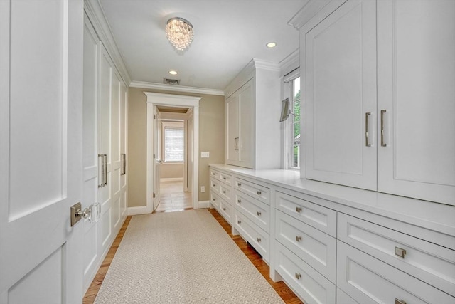 24 Cory Ln, Reading, MA 01867 - hallway featuring ornamental molding, baseboards, recessed lighting, and wood finished floors