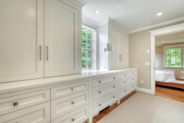 24 Cory Ln, Reading, MA 01867 - bathroom featuring crown molding, wood finished floors, baseboards, and recessed lighting