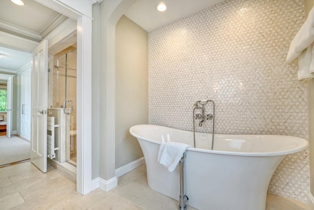 24 Cory Ln, Reading, MA 01867 - bathroom with a stall shower, crown molding, baseboards, recessed lighting, and a soaking tub