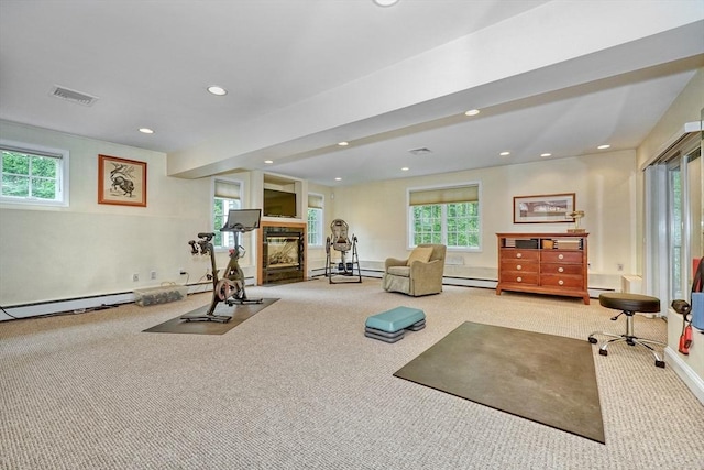24 Cory Ln, Reading, MA 01867 - workout room featuring carpet, a multi sided fireplace, healthy amount of natural light, and recessed lighting