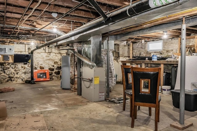 1130 Water St, Fitchburg, MA 01420 - basement featuring water heater, heating unit, and electric panel