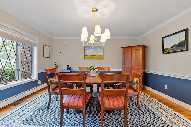 15 Saxon Ln, Shrewsbury, MA 01545 - dining room with a chandelier, light wood-style flooring, crown molding, and a baseboard radiator