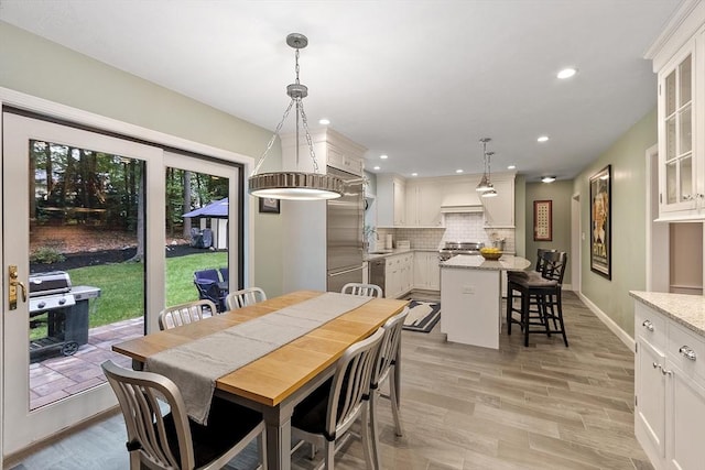15 Saxon Ln, Shrewsbury, MA 01545 - dining area with light wood finished floors and recessed lighting