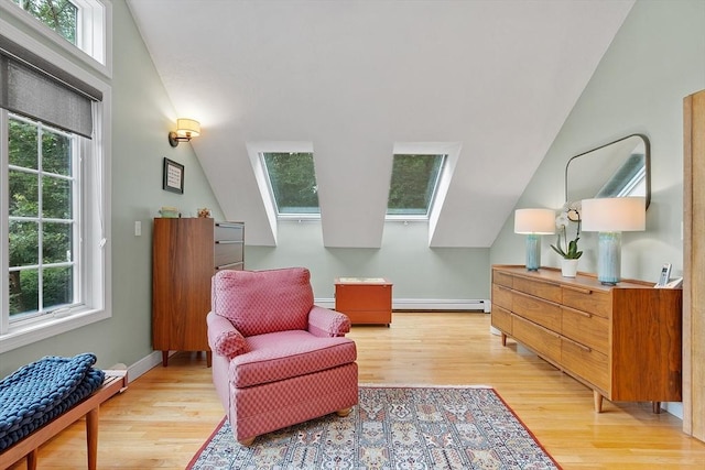 15 Saxon Ln, Shrewsbury, MA 01545 - living area featuring baseboard heating, plenty of natural light, light wood-style floors, and vaulted ceiling
