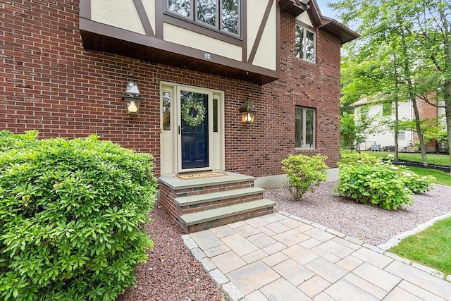 15 Saxon Ln, Shrewsbury, MA 01545 - view of exterior entry with stucco siding and brick siding