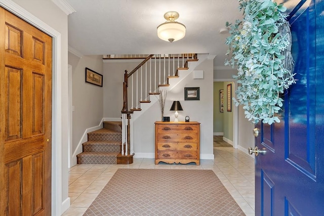 15 Saxon Ln, Shrewsbury, MA 01545 - entryway featuring stairs, light tile patterned flooring, and ornamental molding