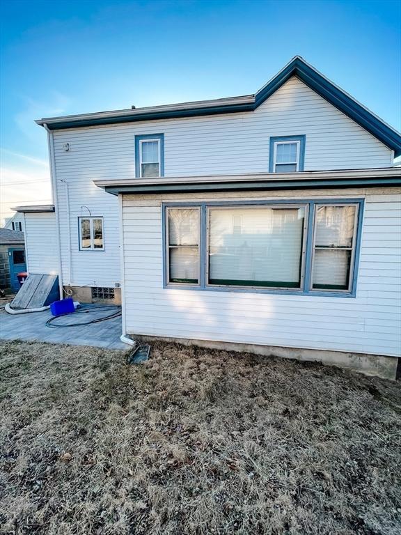 rear view of property with a patio area