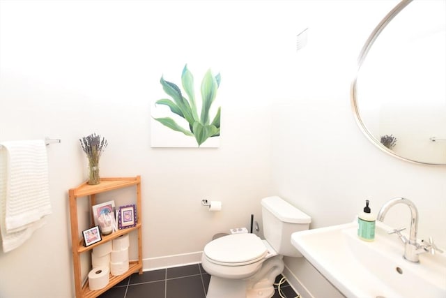 1 Earhart St Unit 320, Cambridge, MA 02141 - half bathroom featuring a sink and tile patterned flooring