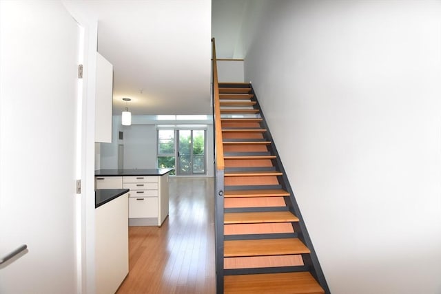 1 Earhart St Unit 320, Cambridge, MA 02141 - stairway with wood finished floors