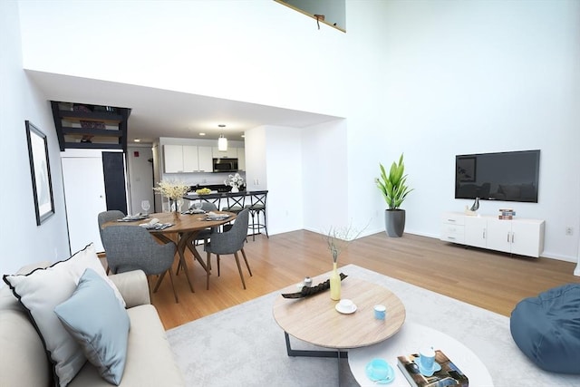 1 Earhart St Unit 320, Cambridge, MA 02141 - living area featuring light wood finished floors