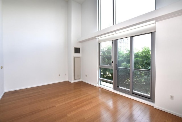 1 Earhart St Unit 320, Cambridge, MA 02141 - empty room with wood finished floors and a high ceiling