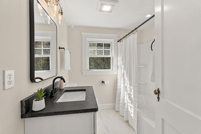 full bath featuring vanity, marble finish floor, baseboards, and a shower with curtain