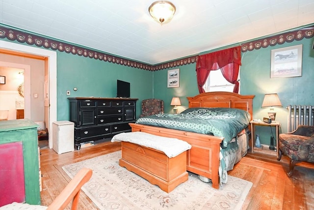 bedroom with light wood-type flooring