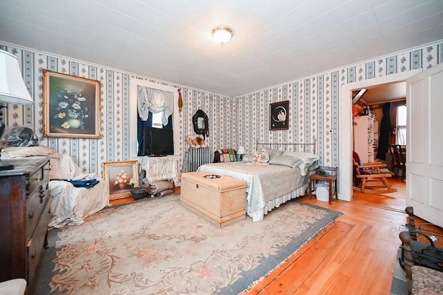 bedroom with wood-type flooring