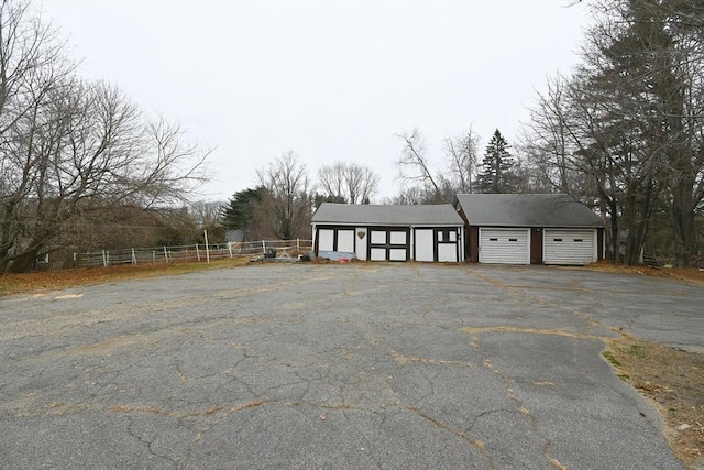 exterior space with an outbuilding and a garage