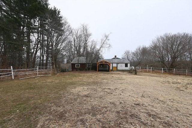 view of yard with a rural view