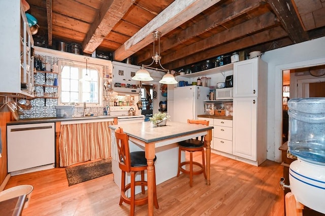 kitchen with decorative light fixtures, white cabinetry, light wood-type flooring, and white appliances