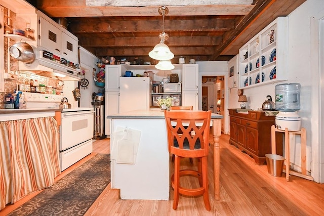 kitchen with beam ceiling, light hardwood / wood-style flooring, white appliances, decorative light fixtures, and white cabinets