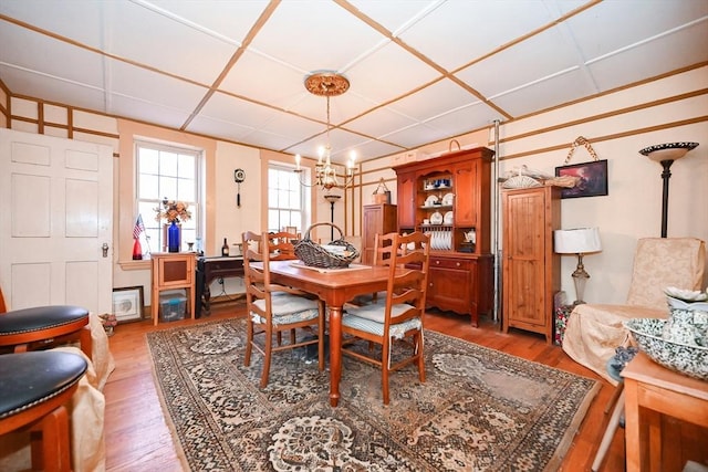 dining space featuring a chandelier and hardwood / wood-style flooring