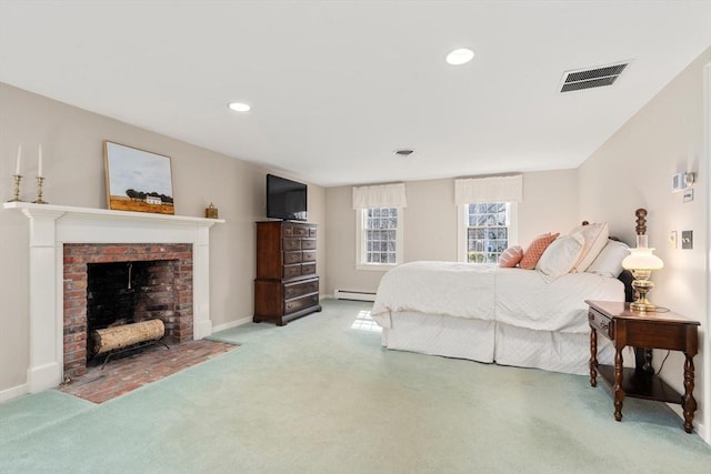 carpeted bedroom featuring visible vents, a baseboard heating unit, recessed lighting, baseboards, and a brick fireplace